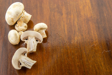 It's time to cook! Fresh mushrooms with spices on a wooden base