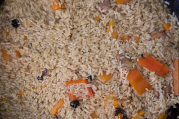 Rice pilaf with meat of a lamb, with stewed vegetables, onions, carrot and garlic