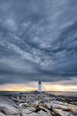 Fototapeta na wymiar nova scotia lighthouse with storm clouds