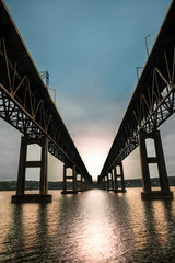 twin bridges over hudson river at sunset