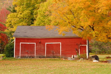 New England red barn in Autumn with brilliant fall foliage © Gerald Zaffuts