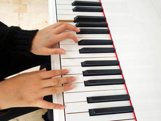 young lady playing the piano
