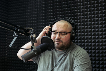 Talking male radio presenter in radio station