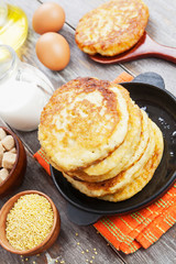 Millet pancakes in a frying pan