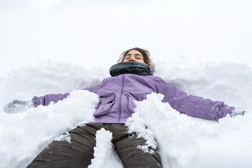 Fototapeta na wymiar Girl in a snowdrift.