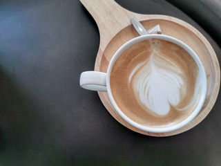 Coffee cup cappuccino hot on Black background,Top view with copy space