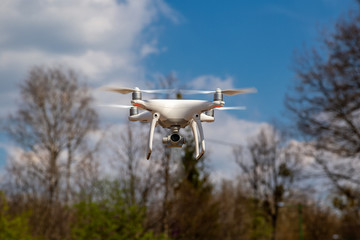 Quadcopter in flight against a blue sky. Drone.