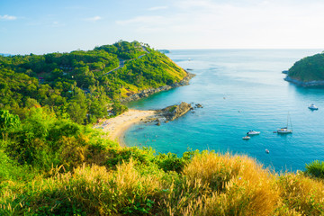 Obraz premium Sea shore sea beach with grass sunset blue sky and island