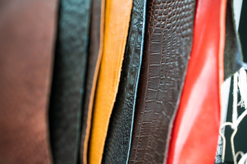 Raw genuine leather on shelf in crafts shop