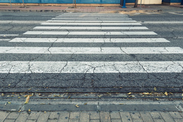 Crosswalk. Close up of  a pedestrian crossing on a two-lane street.