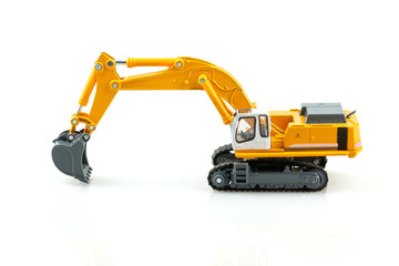 Yellow excavator model toy isolated on white background.