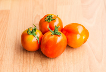 tomatoes on wooden table