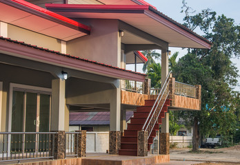 Stairs of new modern two storey bungalow under blue sky