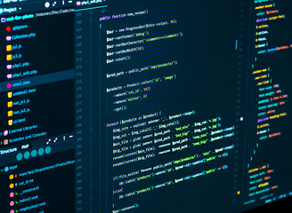 Fototapeta premium Software source code. Programming code. Splitting of css and php code on computer screen, closeup