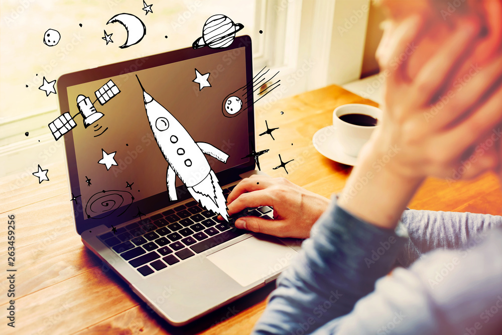 Poster dream of space and rocket with man using a laptop computer