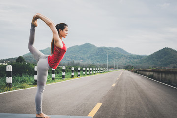 Fototapeta na wymiar Asia woman doing yoga fitness exercise