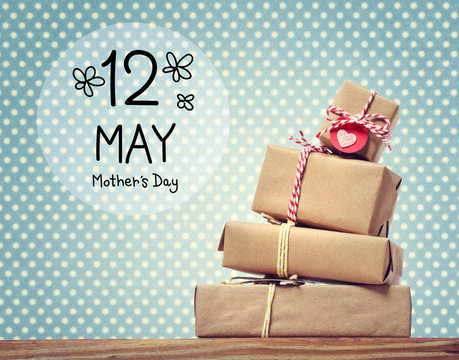 Mothers Day message with stack of gift boxes