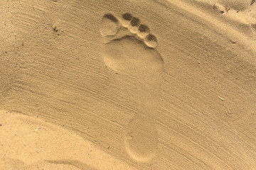 Fußabdruck auf glatt gestrichen Sand