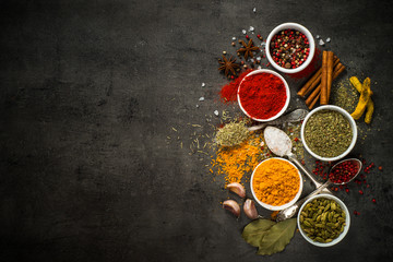 Obraz na płótnie Canvas Set of various spices on black background.