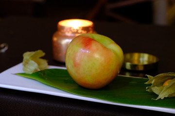 Apple with candle