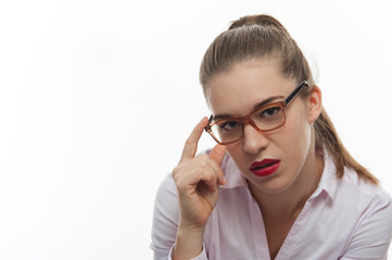 Serious woman in pink blouse looking in the camera