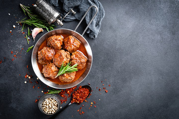 Beef meatballs with spices in tomato sauce