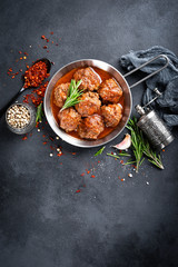 Beef meatballs with spices in tomato sauce