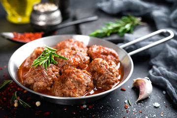 Beef meatballs with spices in tomato sauce