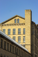 The skyline of the historic Salts Mill in the World Heritage Site of Saltaire, Yorkshire England