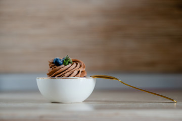 decorated  tasty Cupcake with slice of Strawberry and Chocolate on the table. Horizontal view several objects