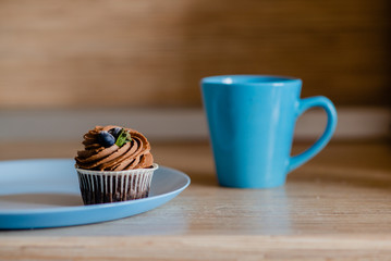decorated  tasty Cupcake with slice of Strawberry and Chocolate on the table. Horizontal view several objects