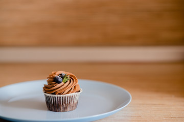 decorated  tasty Cupcake with slice of Strawberry and Chocolate on the table. Horizontal view several objects