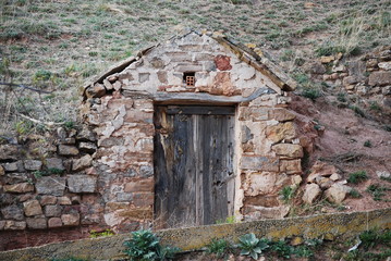 Old door in stone wall