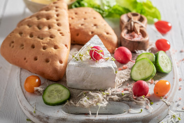 Delicious preparation for sandwich with vegetables, cheese and herbs