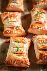 Hot sausage roll with thyme and sesame seeds