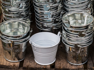 Stacked silver metal buckets