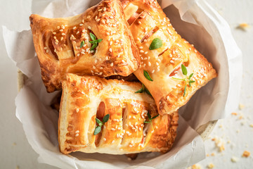 Delicious sausage in puff pastry as a snack for breakfast