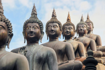 Buddha statues in Gangaramaya Temple in Colombo