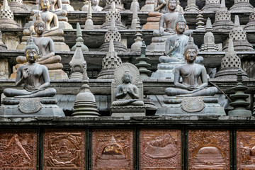 Buddha statues in Gangaramaya Temple in Colombo, Sri Lanka 