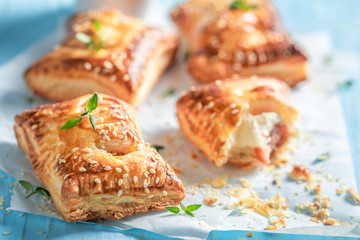 Crispy sausage in puff pastry with thyme and sesame seeds