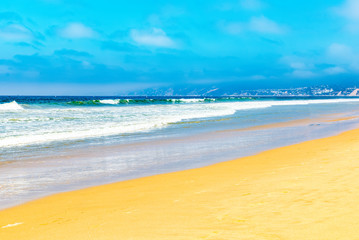 Fototapeta na wymiar View of the beach of Santa Monica and the Pacific Ocean. Suburbs of Los Angeles.