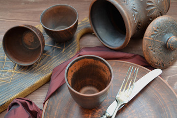 Brown  ceramic dishware and wooden objets in russian style