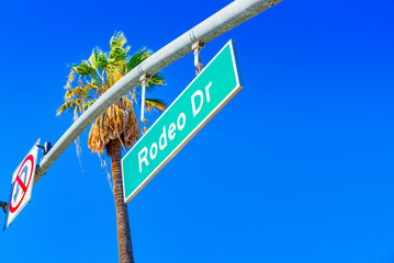 Fototapeta premium Rodeo Drive Road Sign on fashionable street Rodeo Drive in Hollywood.