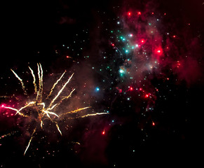Fototapeta na wymiar Beautiful sparks from fireworks in the sky at night