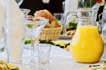 dinner table with glasses and juice