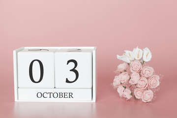 October 03rd. Day 3 of month. Calendar cube on modern pink background, concept of bussines and an importent event.