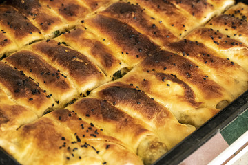 homemade pastries, spinach pie, sesame buns and bagels, Turkish style dough food,