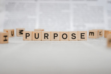 Purpose Word Written In Wooden Cube - Newspaper 