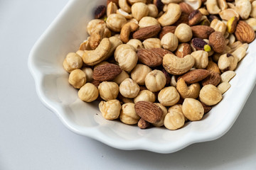nuts, peeled hazelnuts, cashews and almonds, stand together,