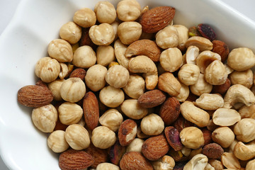 nuts, peeled hazelnuts, cashews and almonds, stand together,